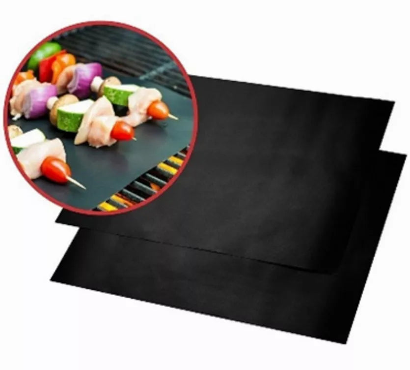 Set of two black BBQ grill mats with non-stick surface, folded flat for storage