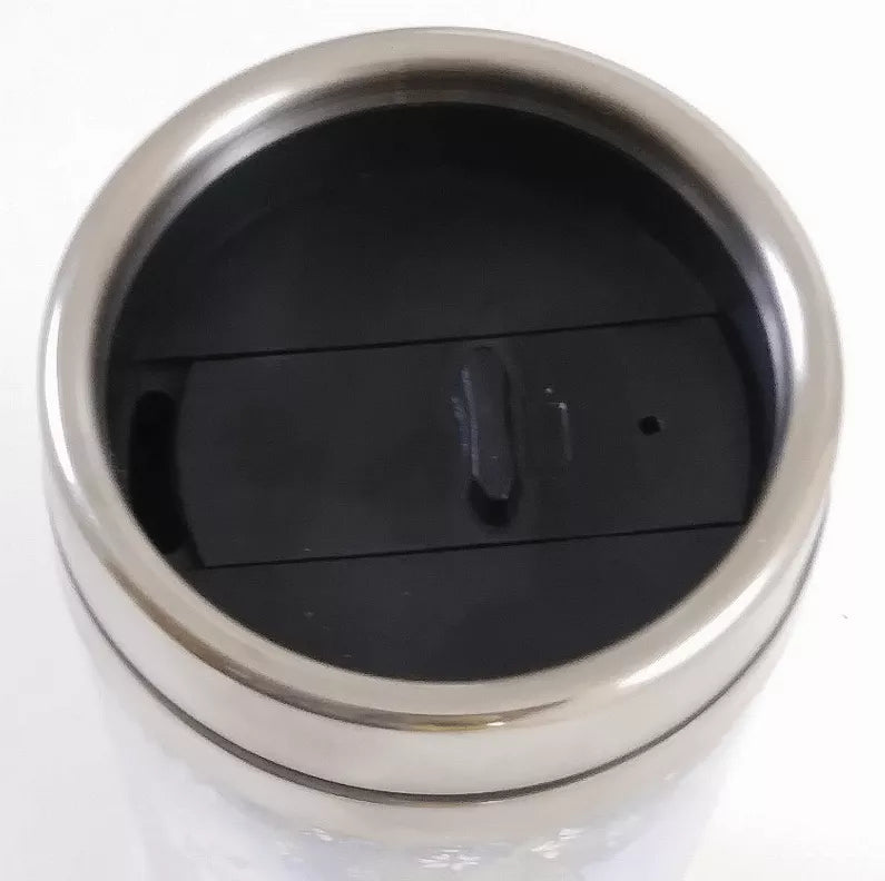 Stainless steel tumbler lid close-up with black interior stopper