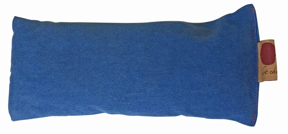 Blue denim eye pillow, rectangular cushion with small side hang tag.