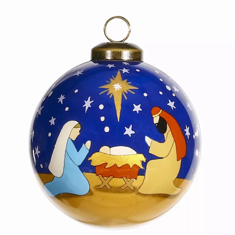 Hand-painted glass ornament with nativity scene, glowing star, blue night sky, gold base