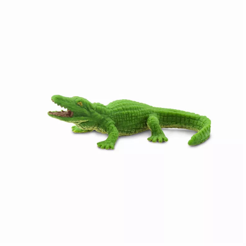 Green alligator toy figure with detailed scales and open mouth