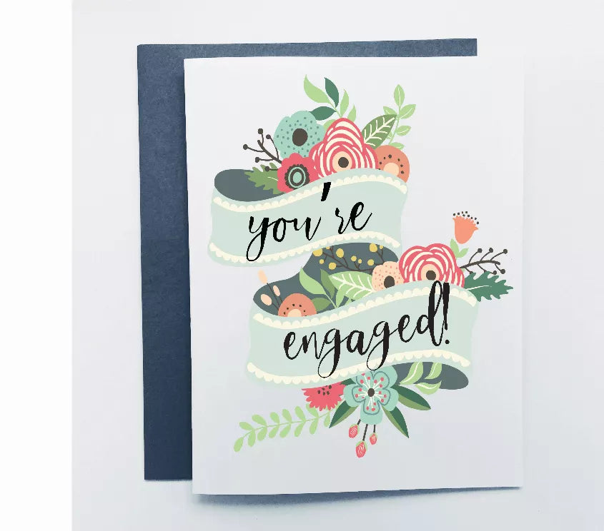 Engagement card with floral design and "You're engaged!" lettering