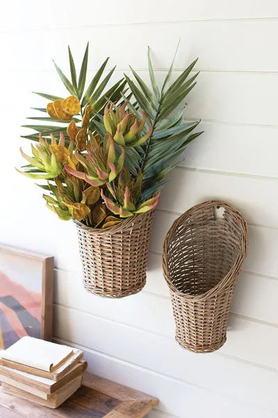 Set of two natural rattan baskets, one tall and one shorter, oval openings