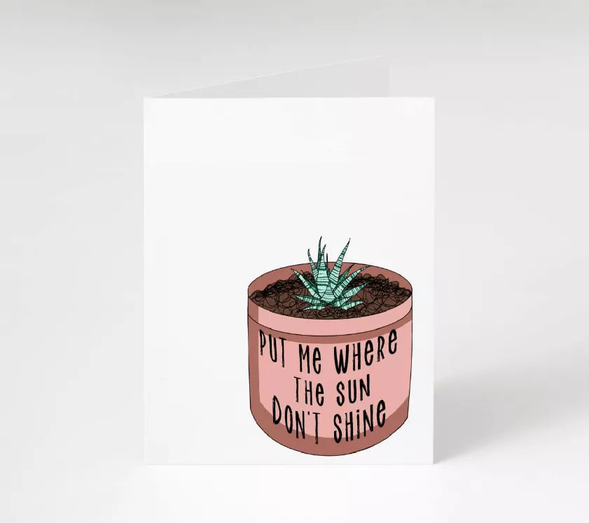 Greeting card with potted plant and text 'Put Me Where The Sun Don't Shine'