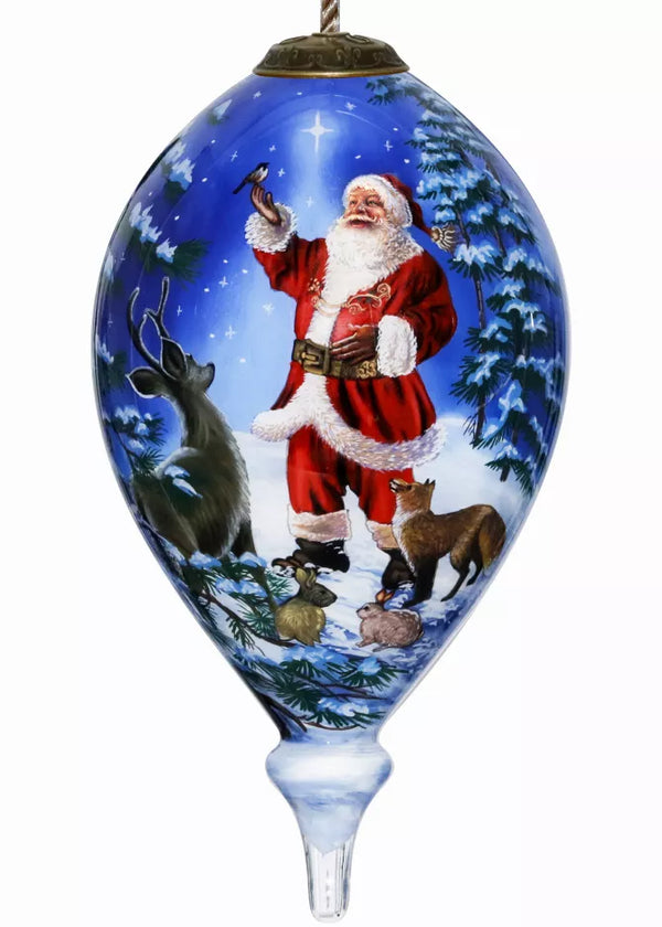 Hand-painted glass ornament with Santa and reindeer in winter forest