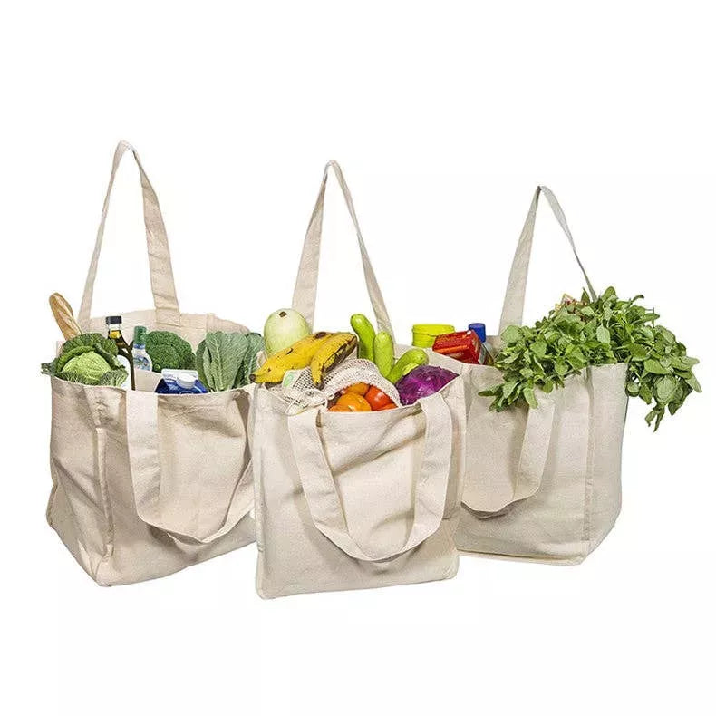 Reusable cotton mesh tote bags with multiple inner compartments, filled with produce