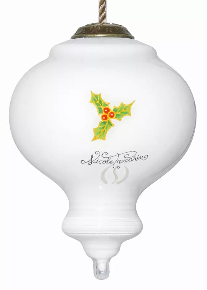 Hand-painted glass ornament with holly motif and cursive signature