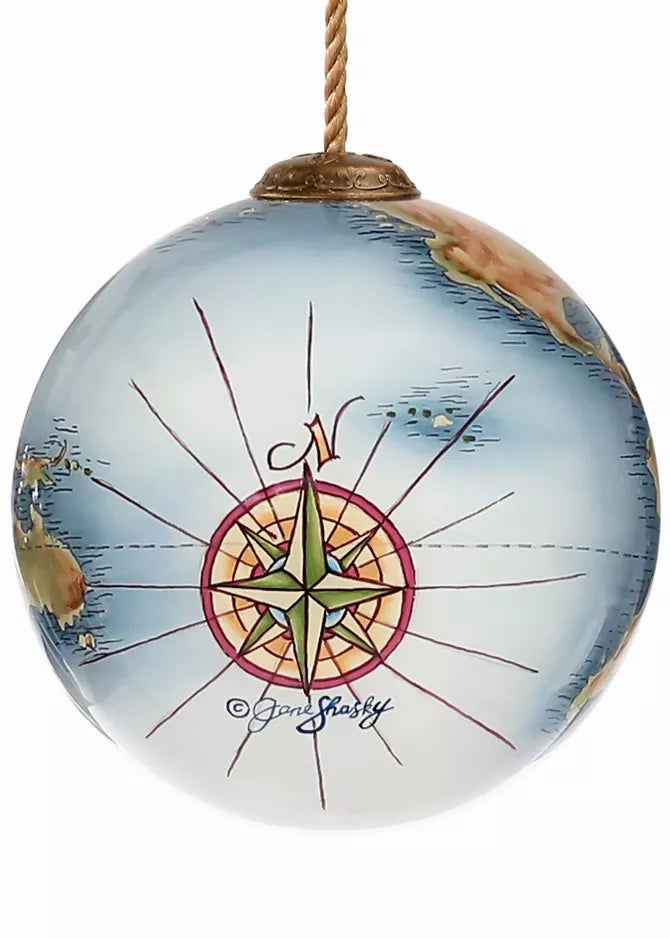Hand-painted glass globe ornament with compass rose and starburst design in blue