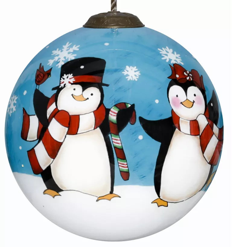 Hand-painted glass penguin ornament, blue with two penguin figures and snowflake details