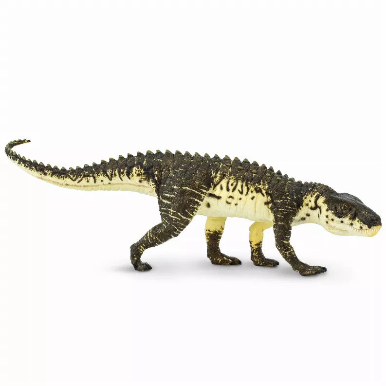 Postosuchus dinosaur figurine with dark green and yellow scaly body, four legs