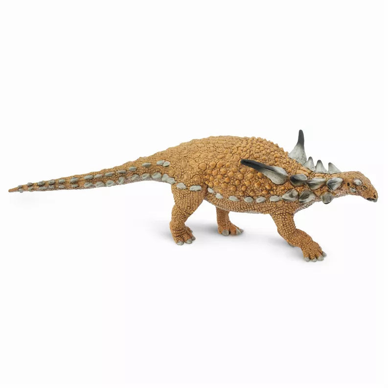Sauropelta dinosaur model, brown armored body with spiked plates and long tail, side view