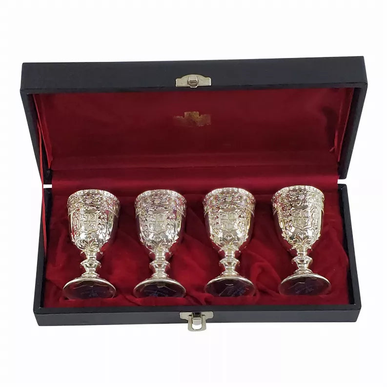 Set of four silver engraved goblets in black presentation case with red lining