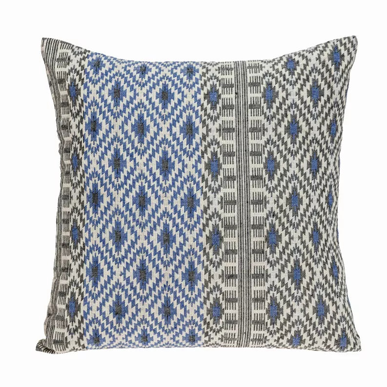 Square accent throw pillow with blue and gray geometric weave on light beige
