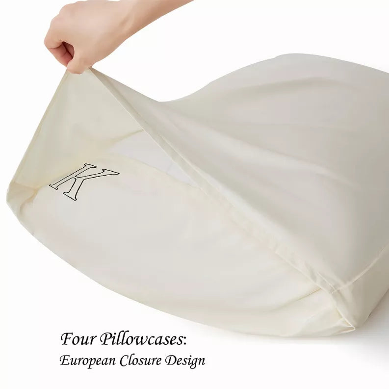 Ivory pillowcase with embroidered K crest on smooth fabric