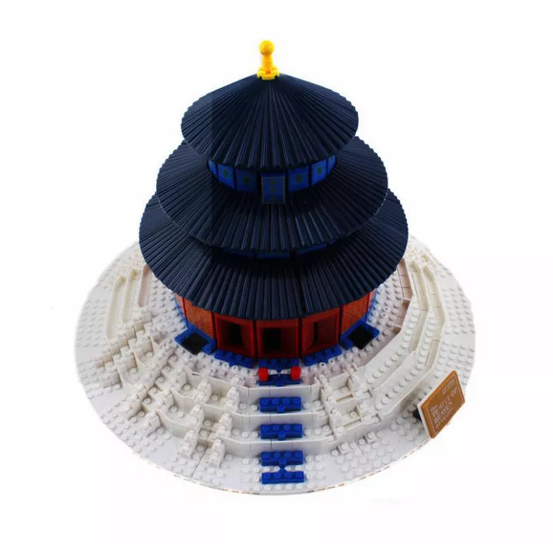 Round base pagoda temple model with stacked dark blue roofs, blue panels and red band