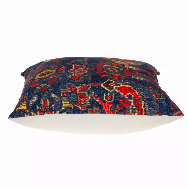 Navy blue tapestry square pillow with multicolor geometric pattern, side view