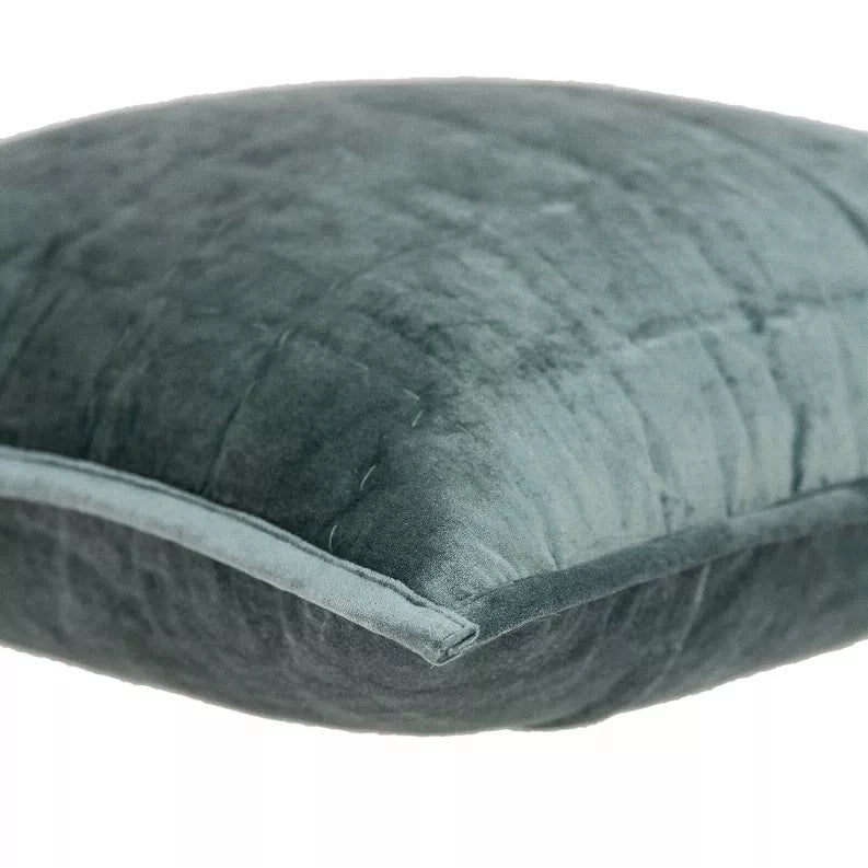 Sea foam quilted throw pillow in textured fabric with stitched edge and seam detail.