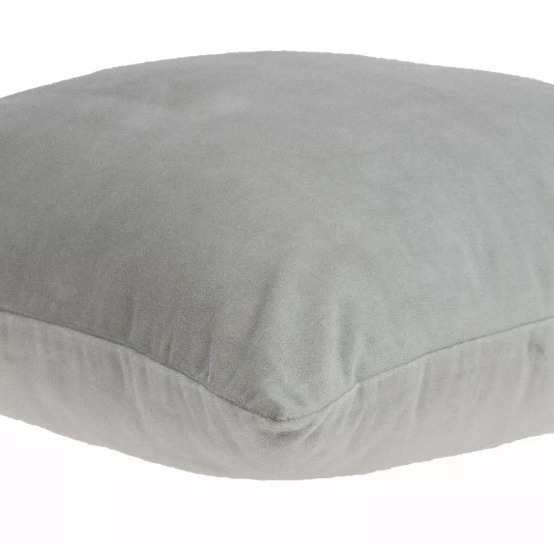 Gray solid throw pillow close-up of smooth fabric surface and rounded seam edge