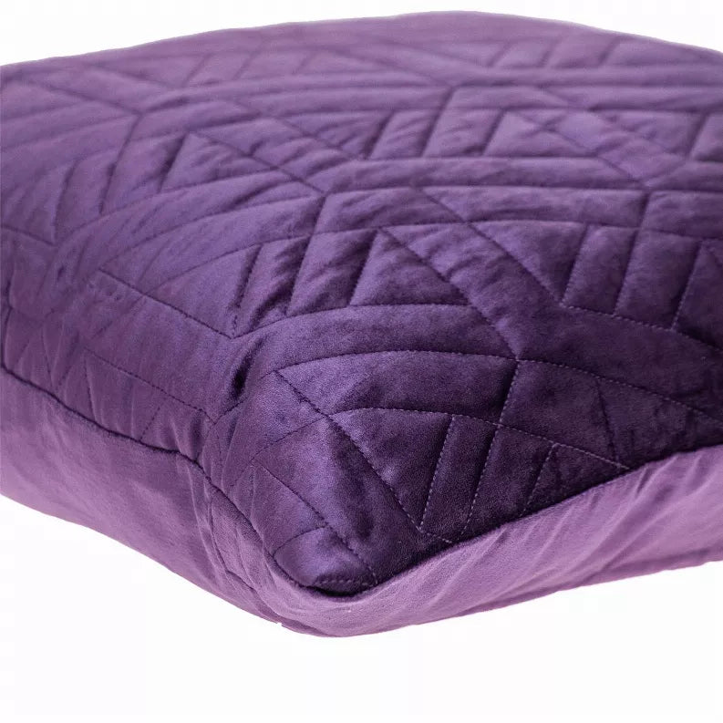 Purple quilted throw pillow side view with diamond channel stitching detail