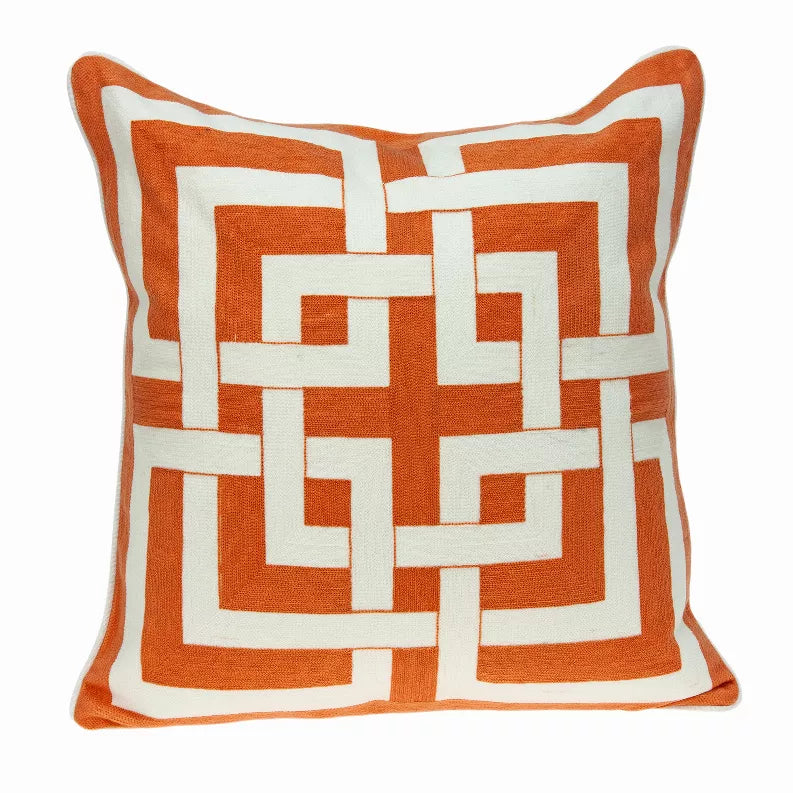 Orange and white geometric patterned throw pillow with square stitched design