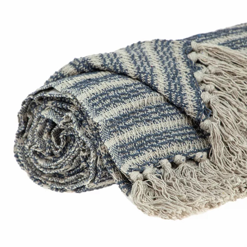 Rolled blue-and-cream striped woven throw blanket with fringe detail