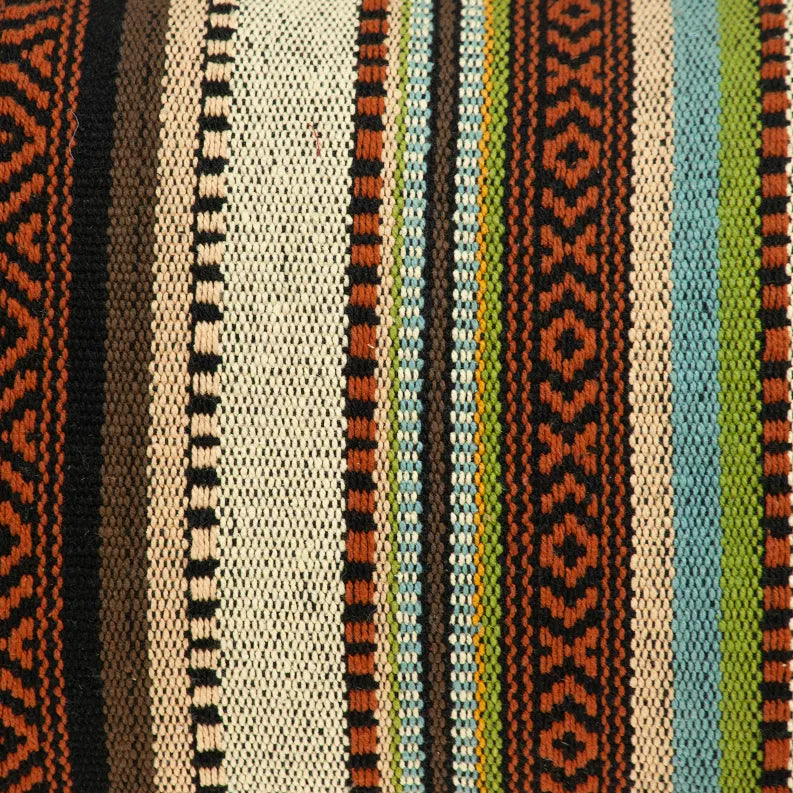 Close-up of woven striped pillow fabric in cream, brown, orange, and teal tones