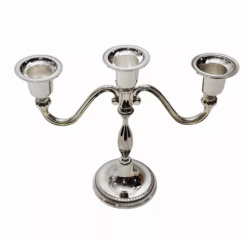 Silver-tone three-candle candelabra with three holders on an ornate round base