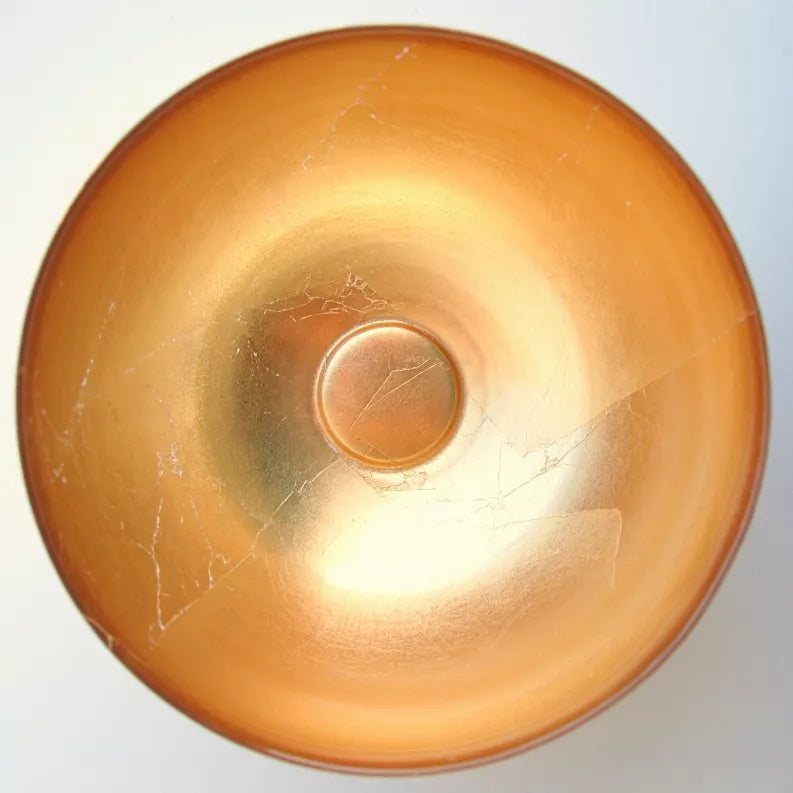 Gold glass bowl top view with circular base detail