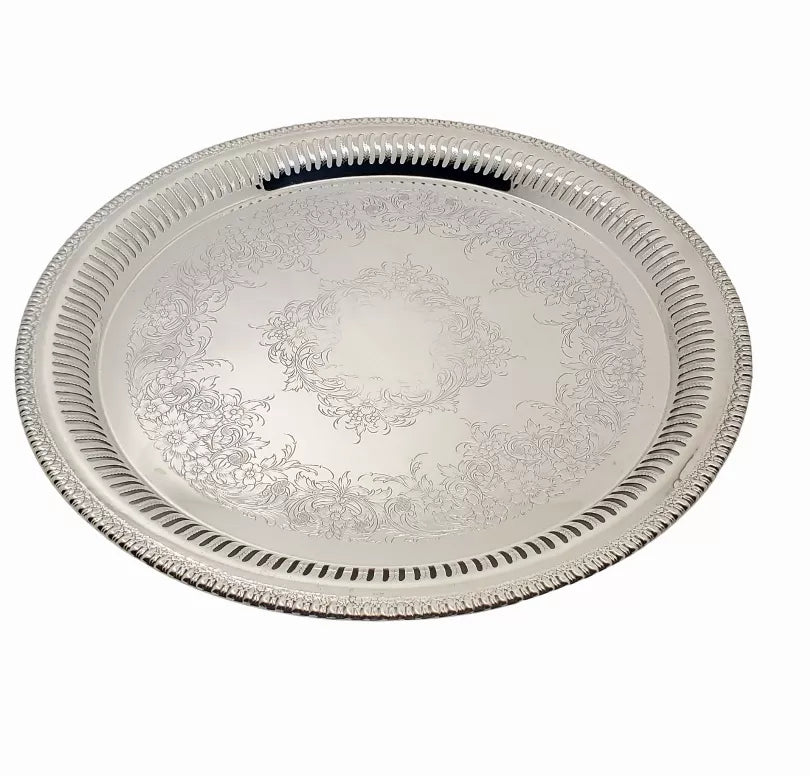 Round silver-plated serving tray with pierced rim and engraved floral design