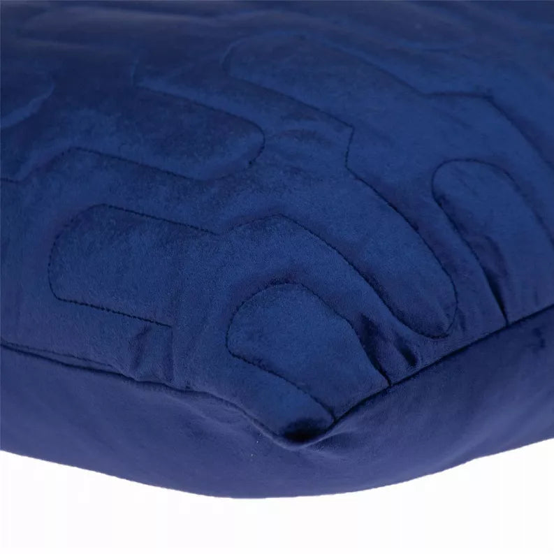 Blue quilted throw pillow close-up of stitched wave-like pattern