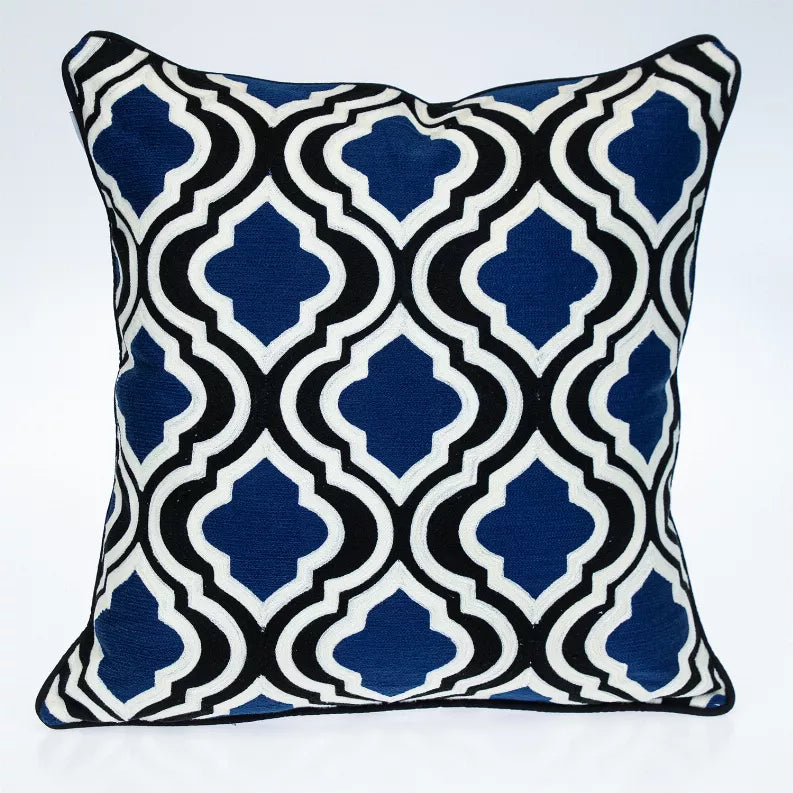 Blue and white geometric square decorative pillow with black outline and stitched seams