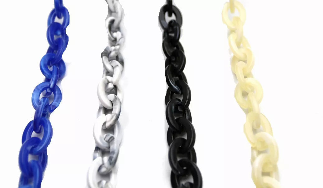Sunglasses chain strap close-up: blue, silver, black, and beige linked chains