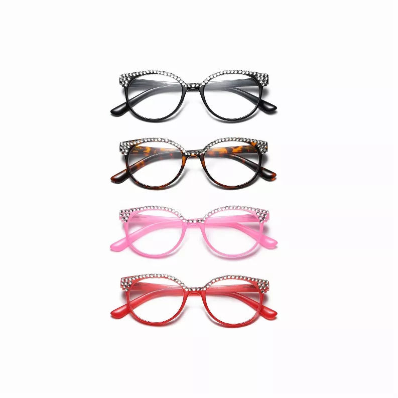 Assorted reading glasses with round frames in black, tortoiseshell, pink, and red with rhinestones