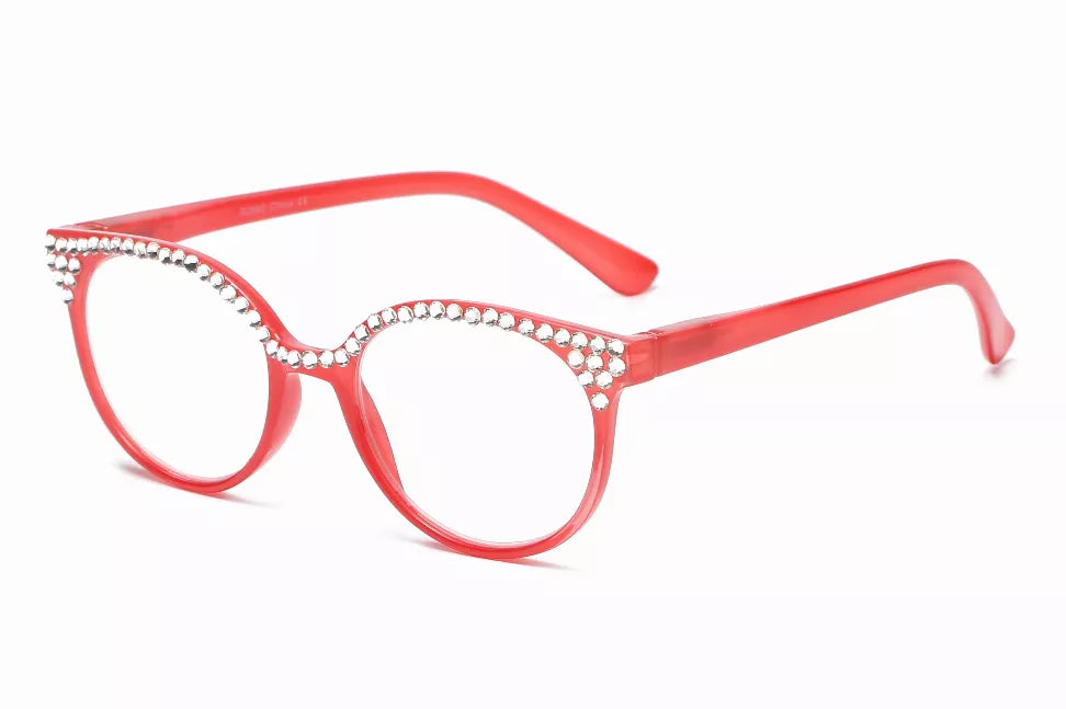 Red reading glasses with round frames and rhinestone trim across the top rim