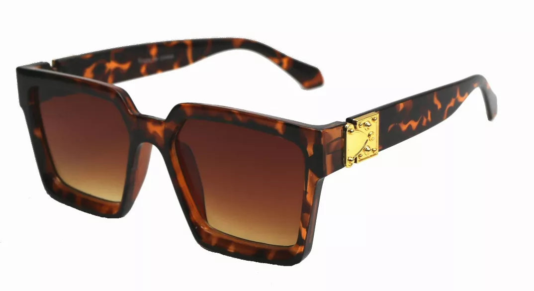 Tortoiseshell square sunglasses with gradient brown lenses and gold logo detail.
