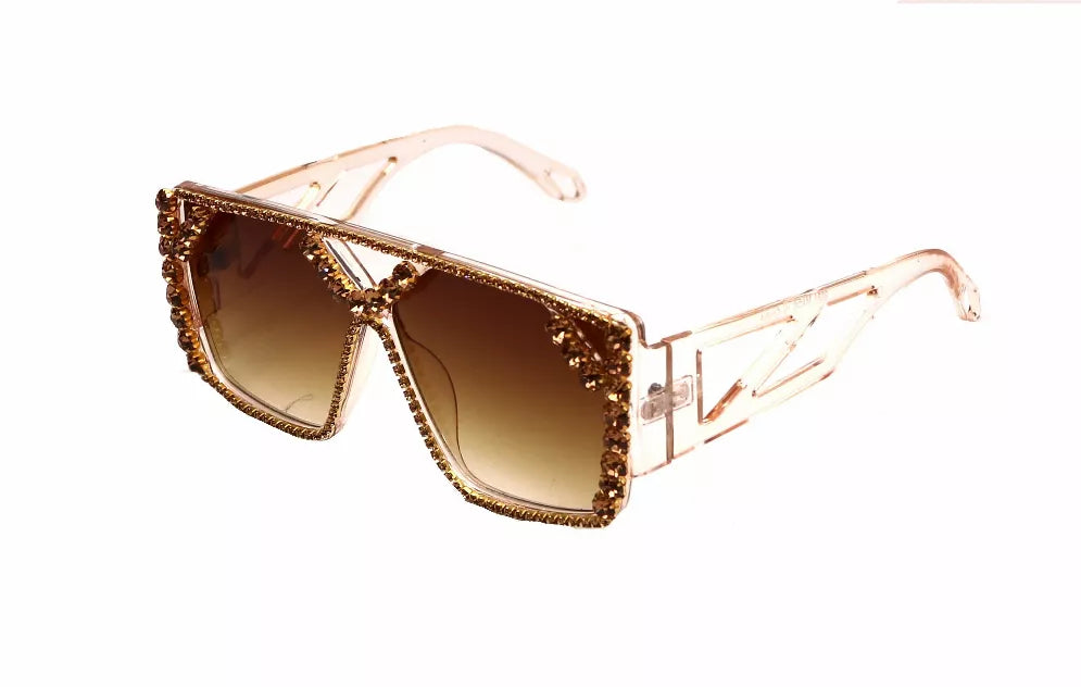 Tan sunglasses with amber lenses and rhinestone-trimmed angular frames
