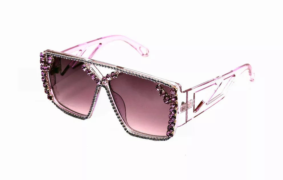 Pink sunglasses with mauve lenses and rhinestone-trimmed angular frames