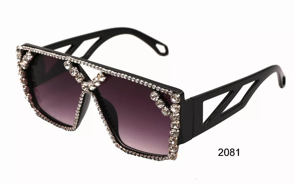 Black sunglasses with purple lenses and rhinestone-trimmed front detail