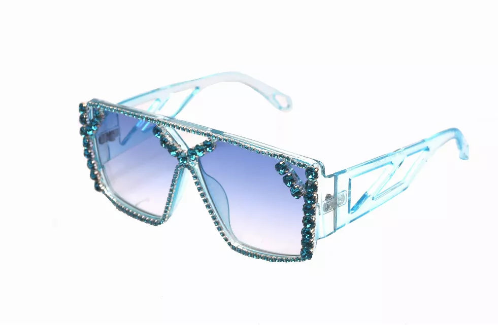 Light blue sunglasses with blue lenses and rhinestone-trimmed angular frames