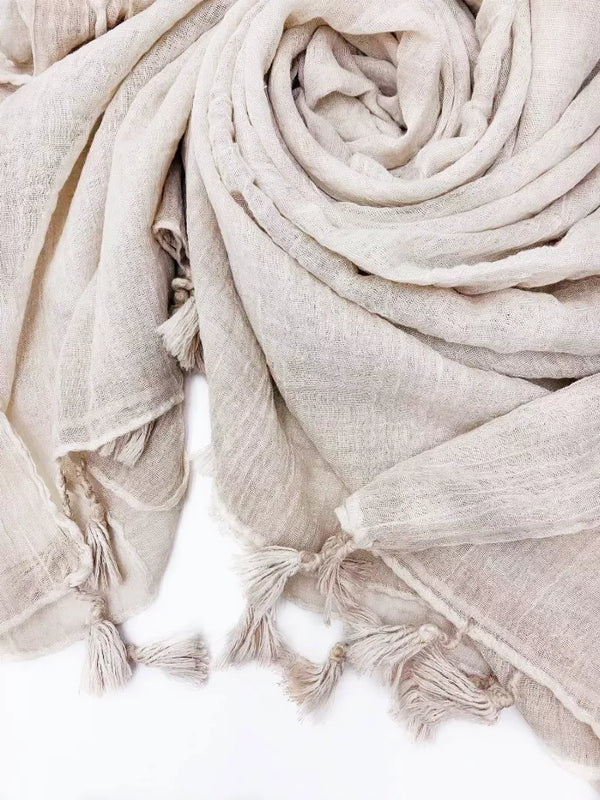 Light solid scarf with tassel fringe trim