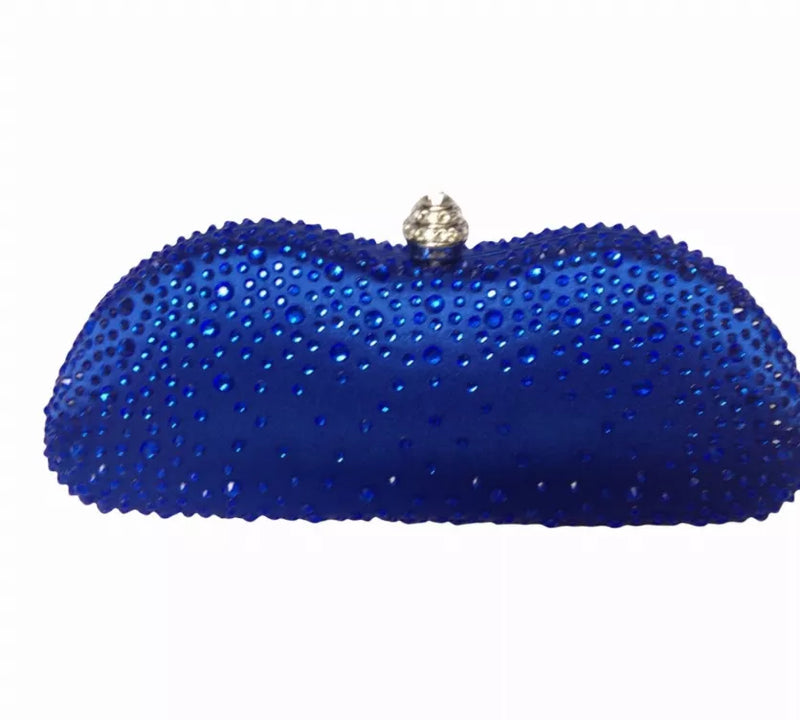 Blue gem-studded clutch purse with textured sparkle and gold-tone clasp