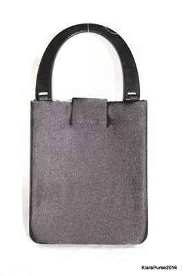 Handbag with dark gray suede-like finish and wide top handles, front patch pocket