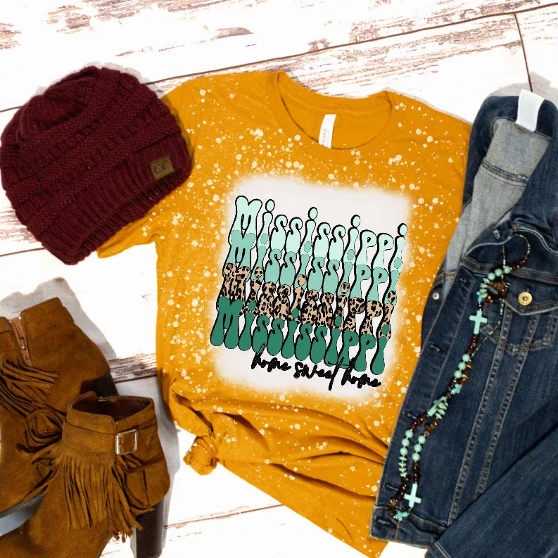 Mustard short-sleeve graphic T-shirt with Mississippi-themed front print