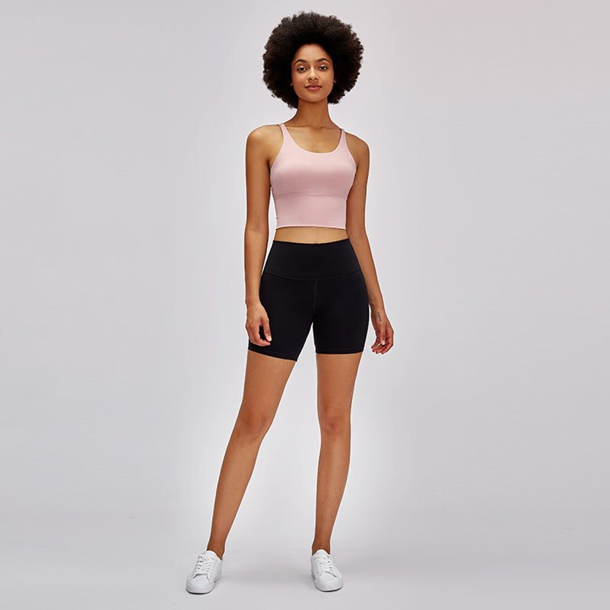 Black high-rise biker shorts, mid-thigh length, smooth seamless look