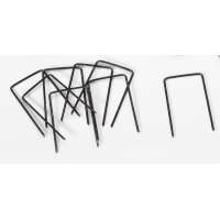 Metal sod staples with bent U-shaped legs in a small pile