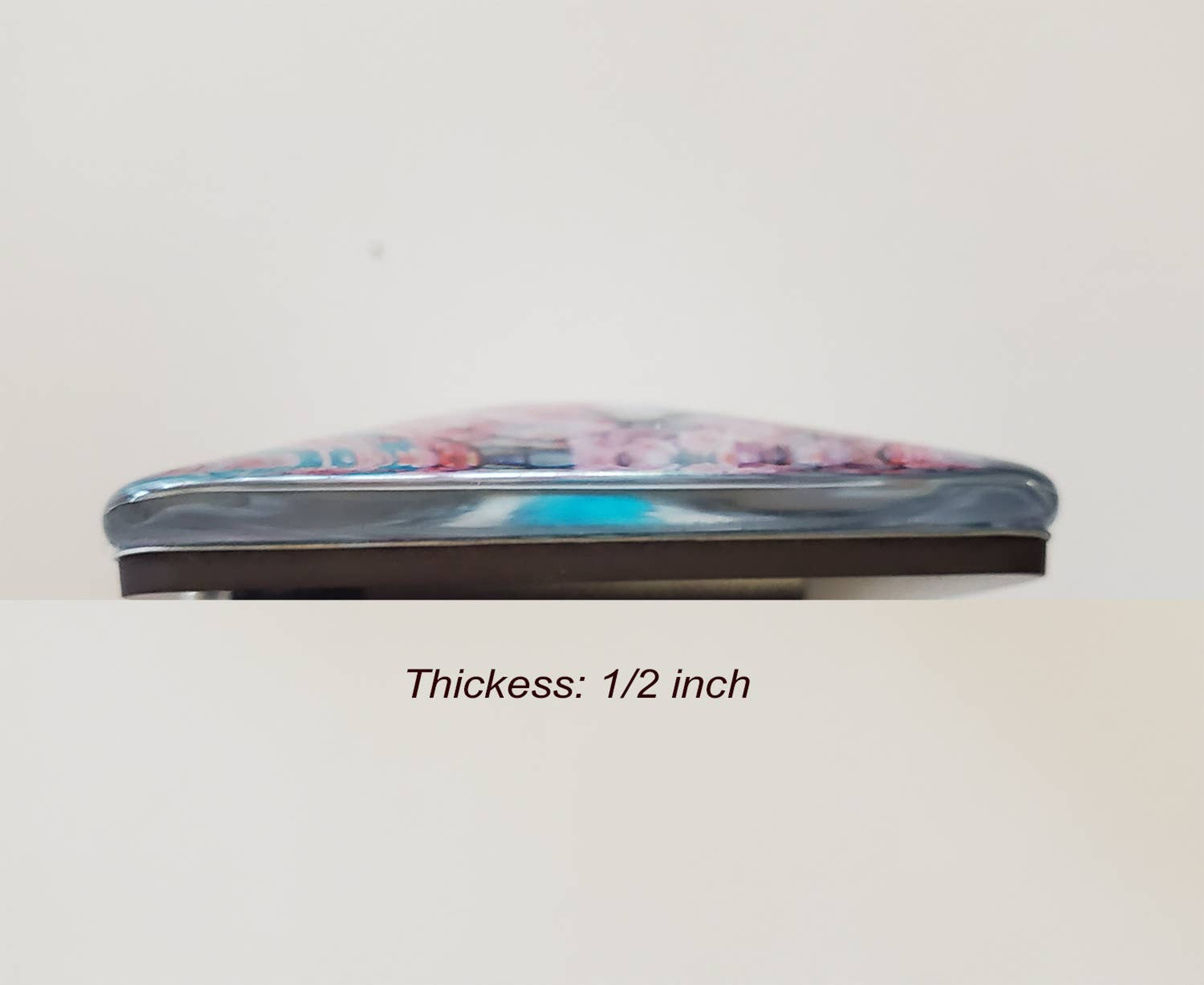 Square acrylic glass magnet edge with metal rim; about 1/2 inch thick