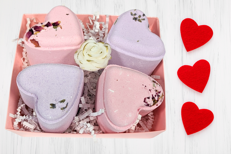 Four heart-shaped shower steamers in a pink gift box