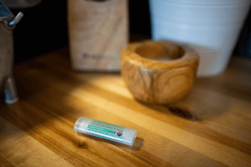 Zambezi core organic lip balm stick on a wooden surface