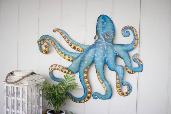 Blue hand-hammered recycled metal octopus wall hanging with raised tentacles