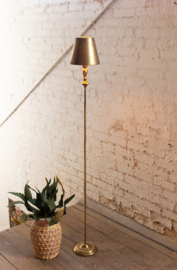 Antique gold floor lamp with conical metal shade and slender stand